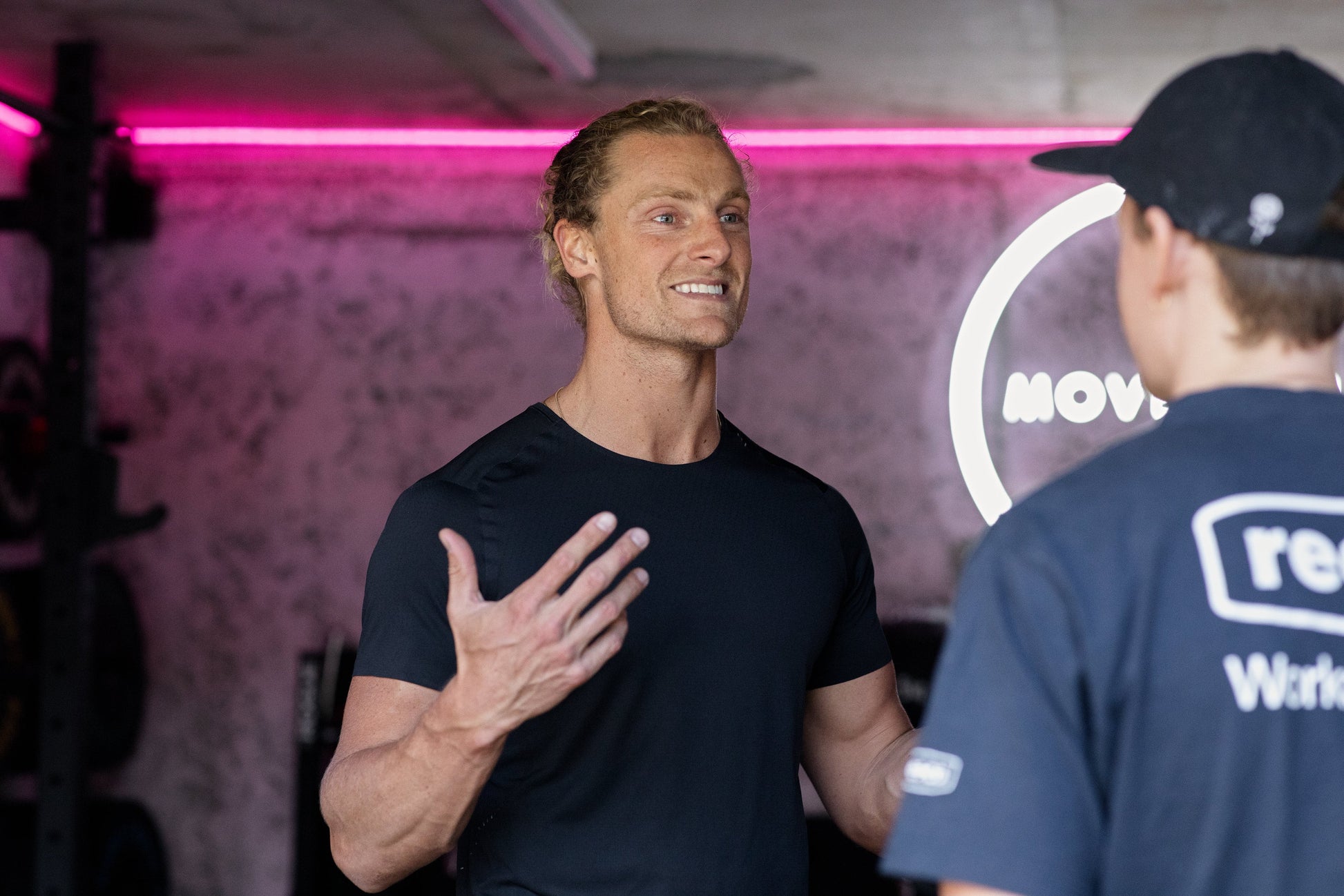 Sam coaching a client one-on-one in the MOVEWELL gym